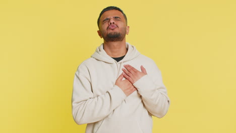 stressed sick indian man suffers from tension holding chest with heart pain attack risk of stroke