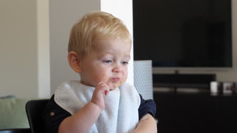 Cute-Blonde-Baby-Boy-Being-Fed-By-Parent