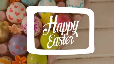 animation of happy easter text over multi coloured easter eggs on wooden surface