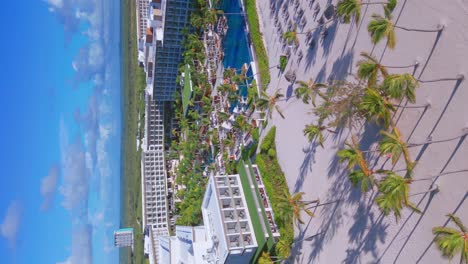 Breathtaking-View-of-Luxury-Beachfront-Hotel-And-Resort-At-Summer-Along-The-Juanillo-Beach-In-Punta-Cana,-Dominican-Republic