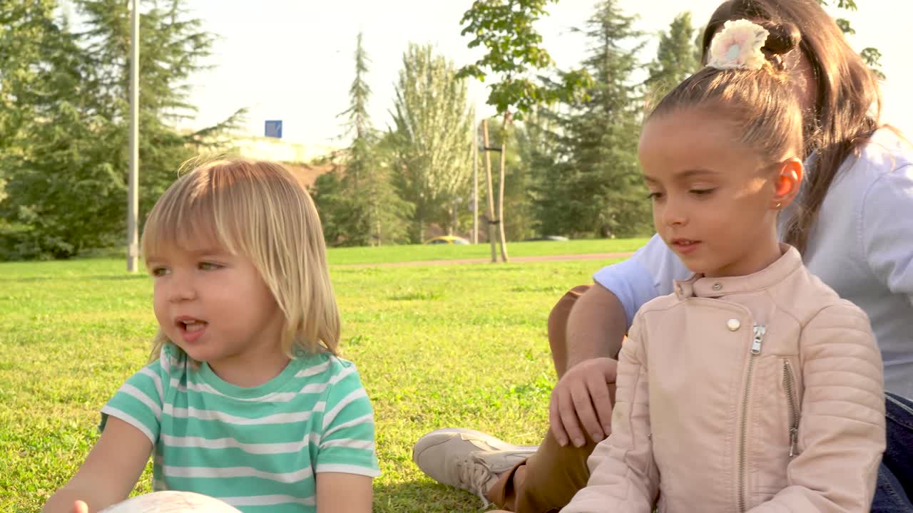 Happy family playing and bonding in a sunny park
