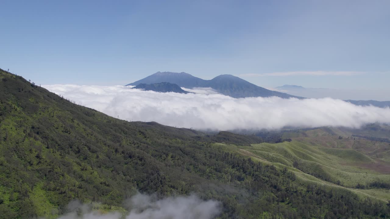 Aerial view of beautiful sky in misty mountains nature in the distance covered in clouds