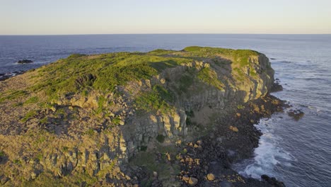 rocky cliffs and coastline of cook island near the fingal head in nsw, australia