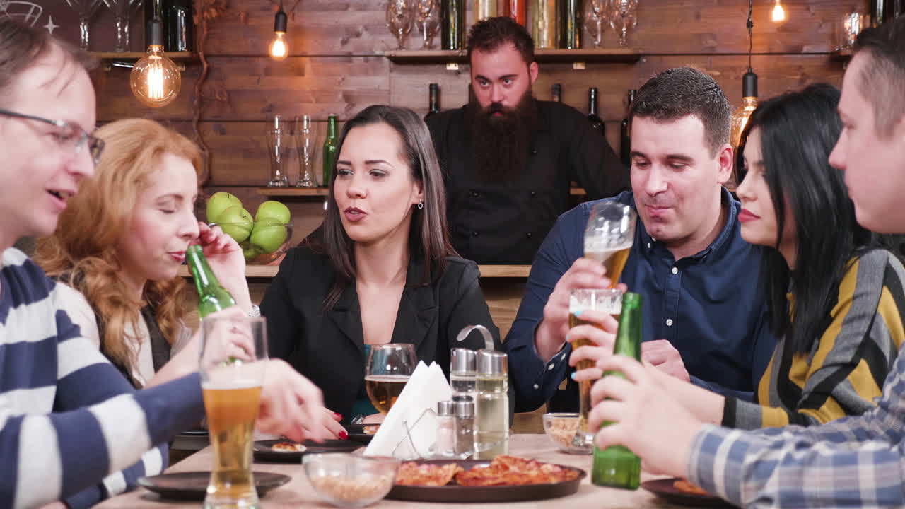 Group of friends having dinner at a restaurant