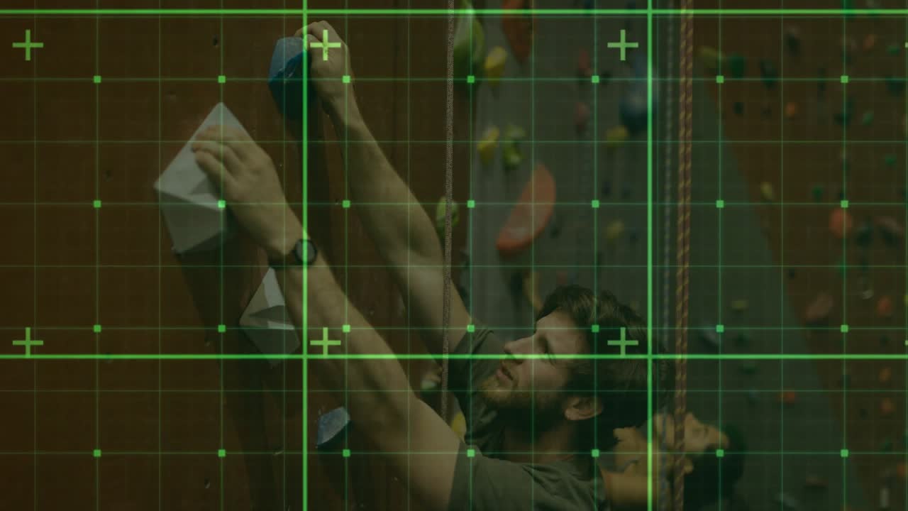 Grid overlay appearing as male climber grasping blue white holds while ascending wall for training