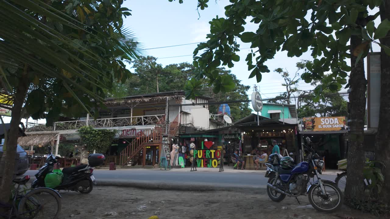 Local shops and cafés along a lively street in Puerto Viejo, Costa Rica