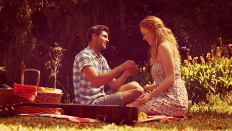 handsome man doing marriage proposal to his girlfriend