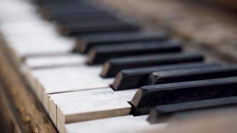 closeup of old broken piano keys with grunge