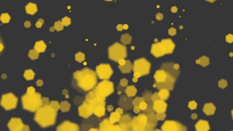 Yellow-glitters-and-particles-on-black-background