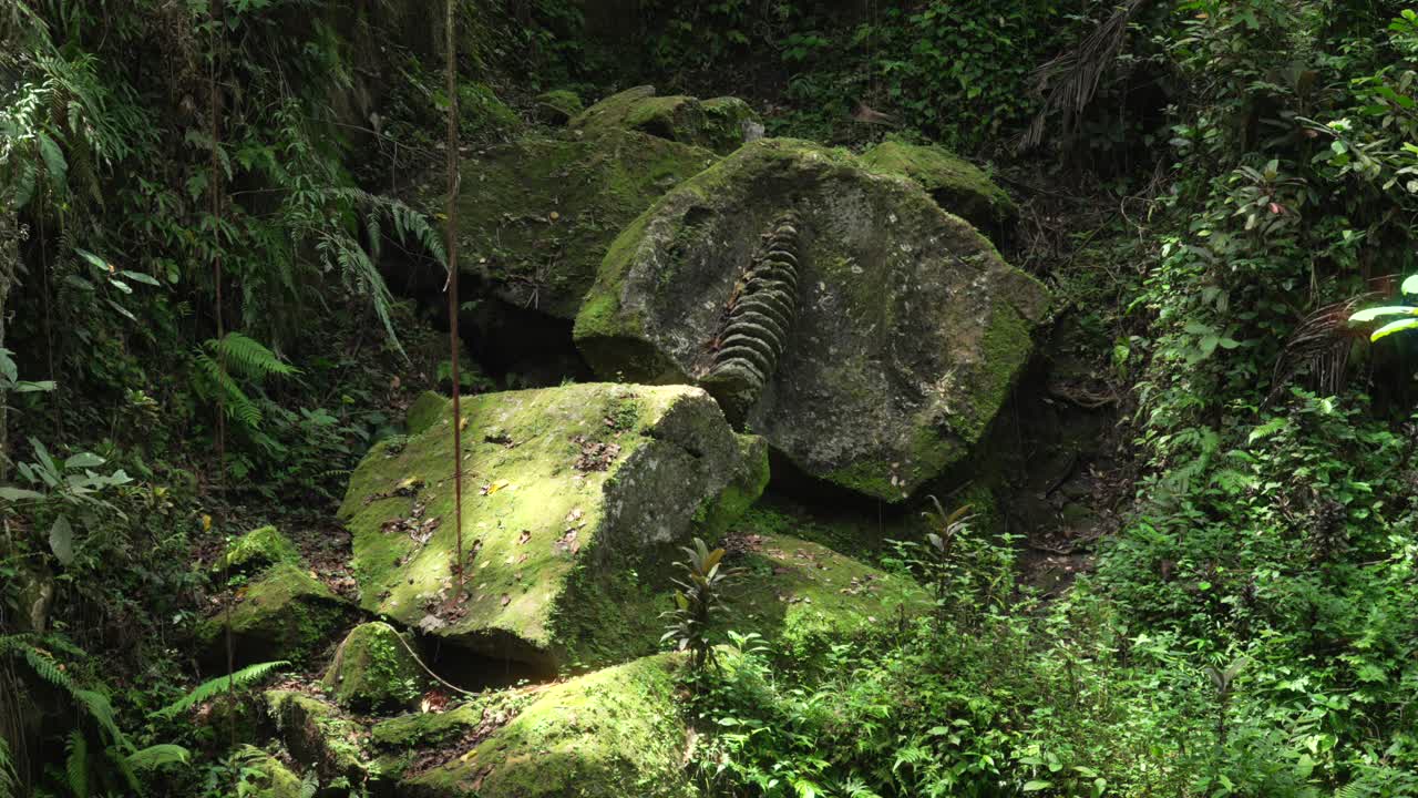 Stone carvings archeological jungle site Ubud Bali Indonesia tropical landscape
