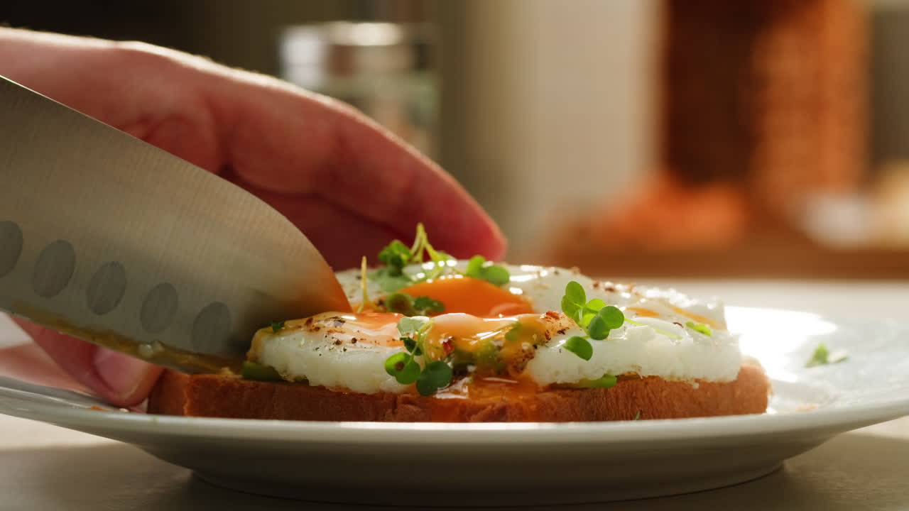 Preparing a Delicious Avocado Toast with Sunny-Side Up Eggs