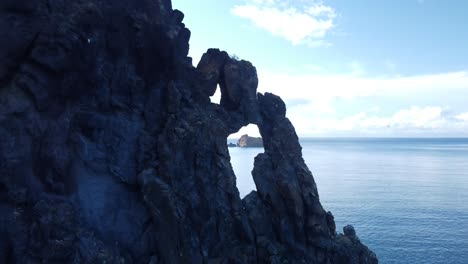 drone shot of massive sea stacks near ribeira da janela, portugal