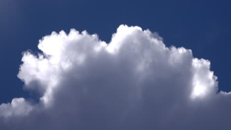 Beautiful-white-thick-cloud-rolling-in-the-bright-blue-sky