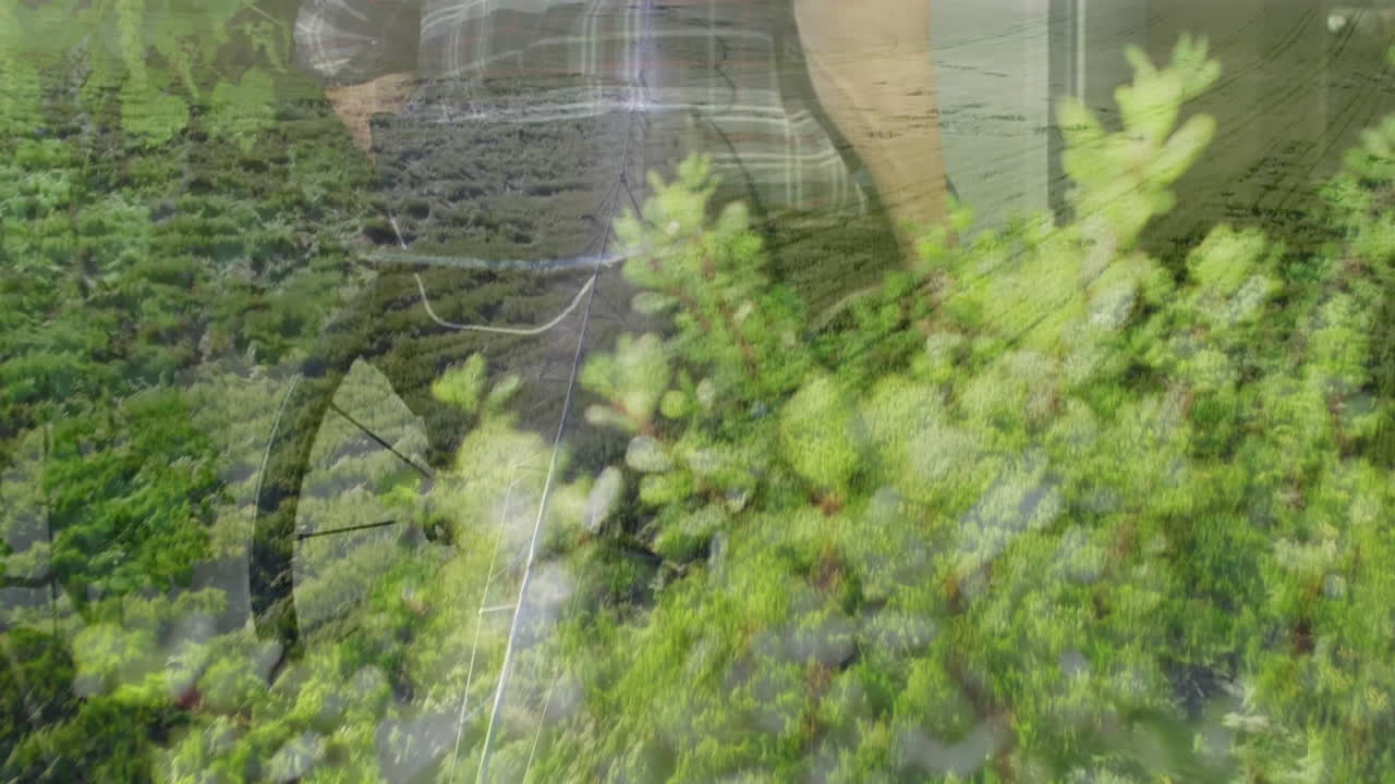 In field with mountains, man working surrounded by lush green landscape