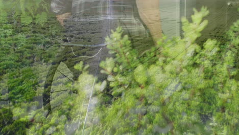 in field with mountains, man working surrounded by lush green landscape