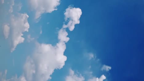 Seamless-loop-of-fluffy-clouds-in-a-blue-sky-in-a-summer-shot-on-a-clear-day