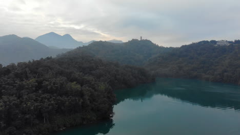 Arial-drone-shot-of-Sun-Moon-Lake-and-Xuanzang-Temple-early-in-the-morning