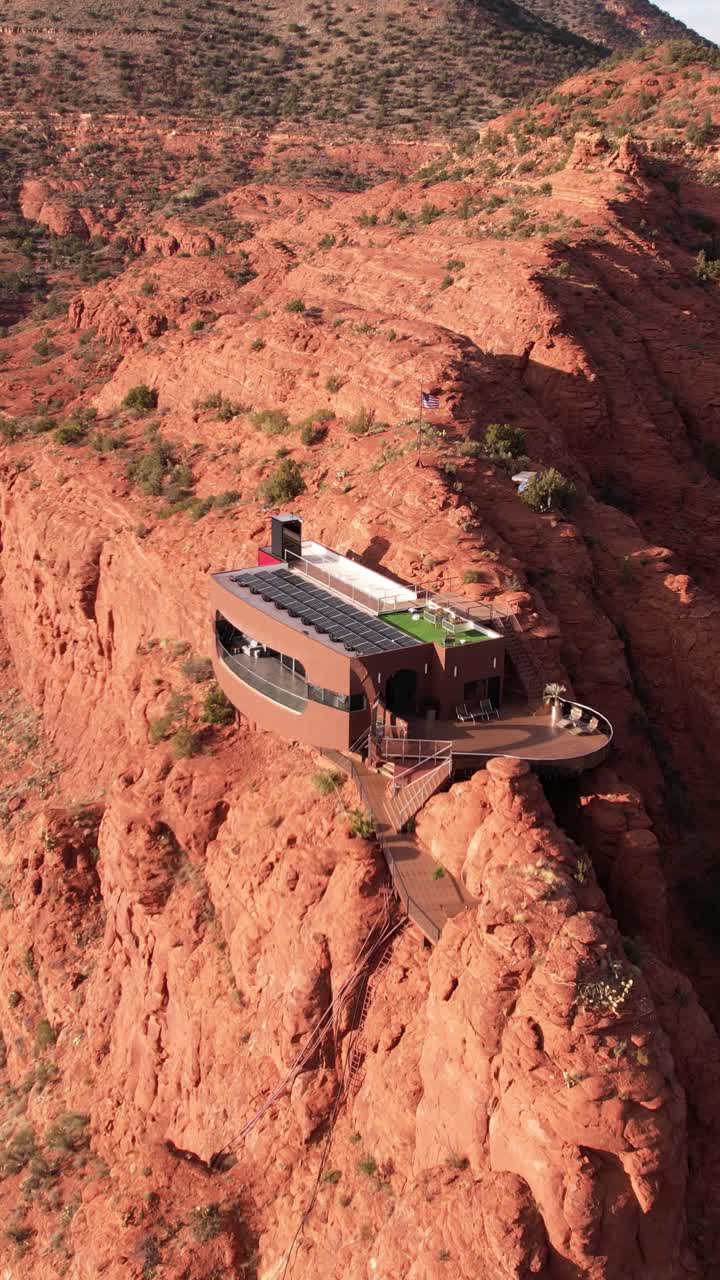 Vertical Drone Shot of Modern House on Sandstone Cliff, Futuristic Villa With Solar Panels, Sedona Arizona USA