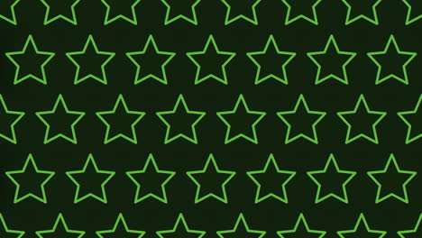 patrón simétrico de estrellas verdes sobre un fondo negro