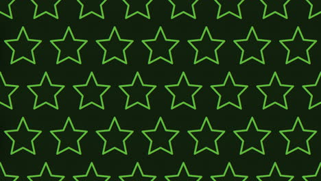 symmetrical pattern of green stars on black background