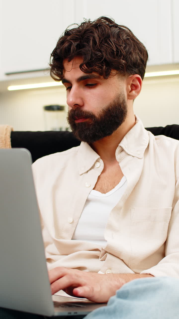 Indian man freelance laptop user typing focused planning ideas for future project remote job success