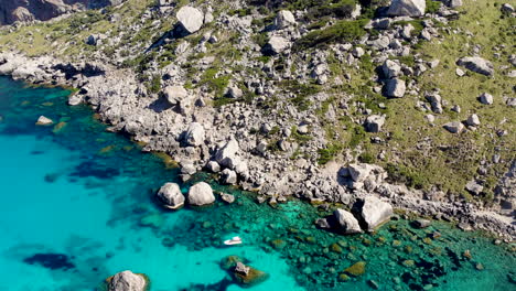 small leisure boat anchored in idyllic turquoise mediterranean sea