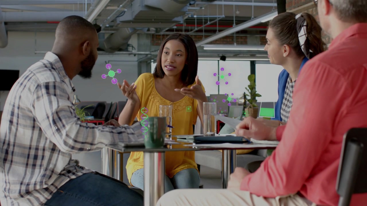 Woman in yellow lifting head and leading discussion, office team leaning, overlays annotating faces