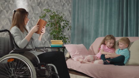 Mother-sits-in-wheelchair-reading-fairytale-for-children