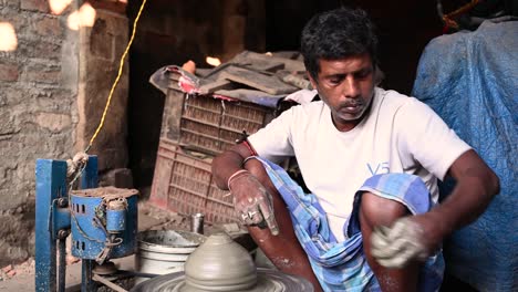 traditional diya made of clay and mud placed in sunlight at diya factory in rural india.