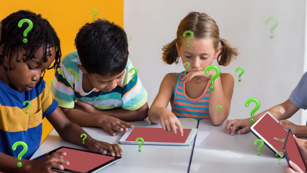 Animation of green question marks over diverse elementary school pupils using tablets in class