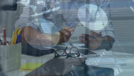 animation of financial data and graphs over hands of african american man using tablet