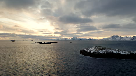 flying over henningsvaer or henningsvær travel destination of lofoten islands in norway at sunset in winter season