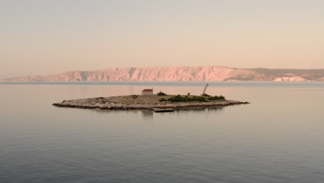 sveti marin chapel in croatia during sunrise, beautiful small island in the middle of the sea, calm waters of the adriatic sea, early morning quiet sea view, peaceful landscapes, golden hour, travel