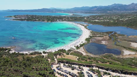 Brandinchi-Beach-Parking-and-Salt-Lakes-in-San-Teodoro,-Sardinia---Aerial-4k