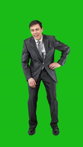 businessman in suit displaying various emotions on green screen