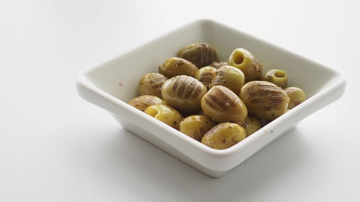 Green Olives in a Small White Bowl