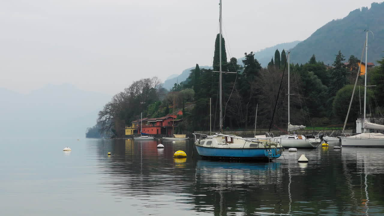Sailboats on the coastline near Bellagio, Lake Como, Italy