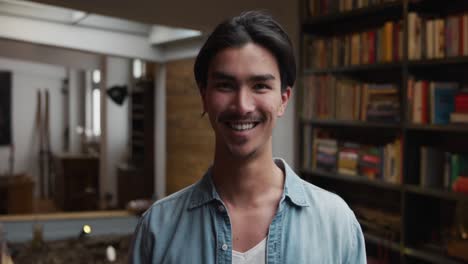 Mixed-race-man-looking-at-camera-and-smiling