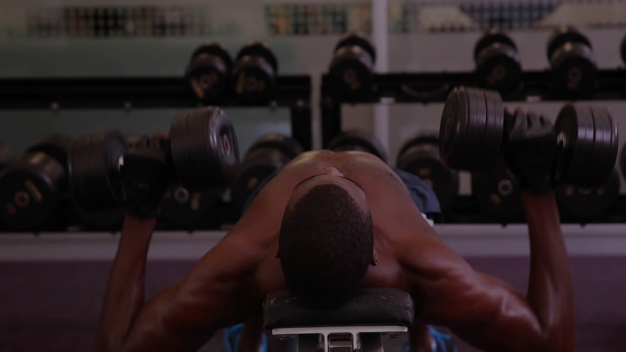 Man starting set gripping weights on bench performing chest flies with HUD tracking fitness metrics
