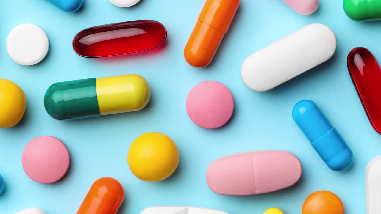 Assortment of Pills on Blue Background