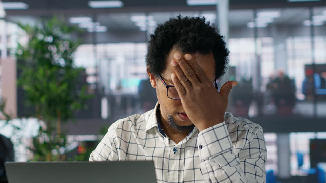 Man Working on Laptop in Office