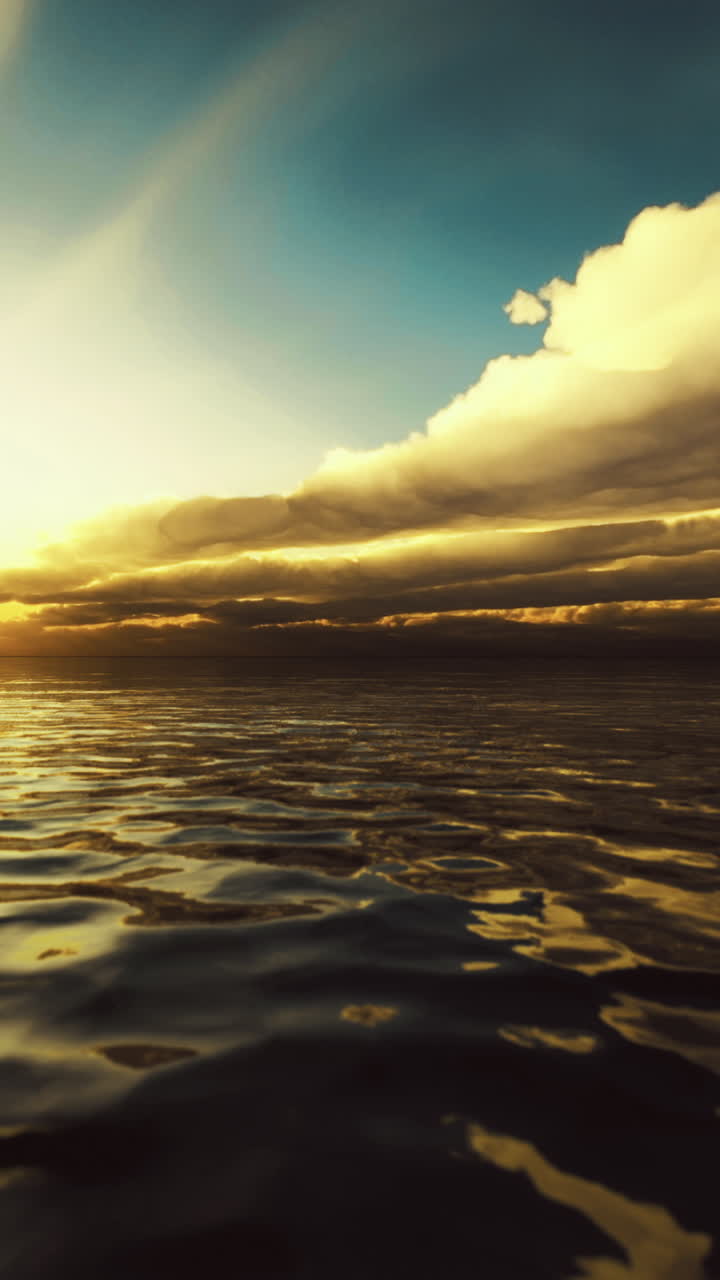 Beautiful sunset over calm waters with dramatic clouds in the sky