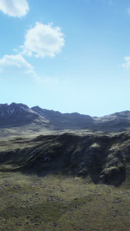 an aerial view of a mountain range in the mountains