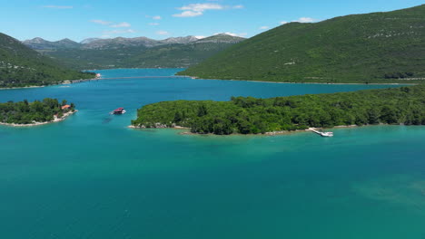 mali ston bay with oyster farm and croatian defenders bridge in the distance in ston, croatia. - aerial shot