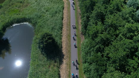 People-Cycling-Inside-The-Park-Of-Goudse-Hout-In-Gouda,-Netherlands