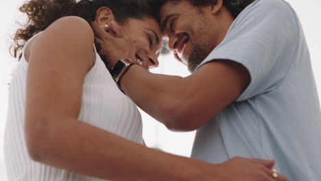 happy young couple sharing romantic connection boyfriend kissing girlfriend enjoying intimate relationship