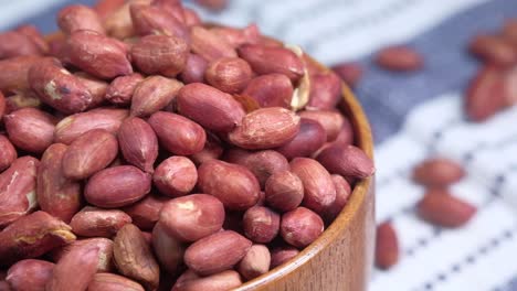 roasted peanuts in wooden bowl