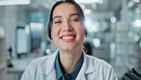 scientist in a lab coat smiling