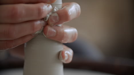Hands Shaping Clay on a Pottery Wheel