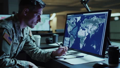 military soldier analyzing global data on a computer